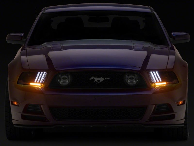 Raxiom 13-14 Ford Mustang LED Projector Headlights SEQL Turn Signals- Blk Housing (Clear Lens) Headlights Raxiom