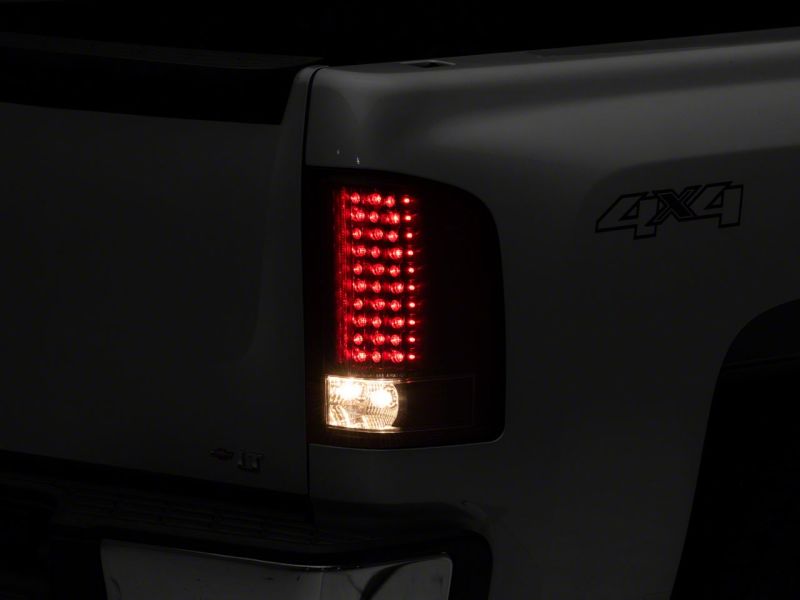 Raxiom 07-13 Chevrolet Silverado 1500 LED Tail Lights- Blk Housing (Clear Lens) Tail Lights Raxiom