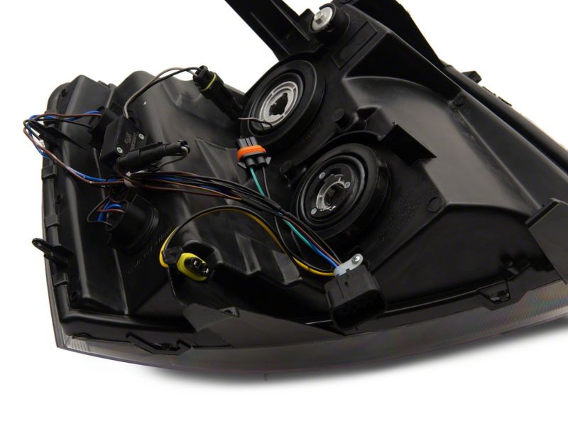 Raxiom 07-13 Chevrolet Silverado 1500 Axial Series Headlights w/ LED Bar- Black Housing (Clear Lens) Headlights Raxiom