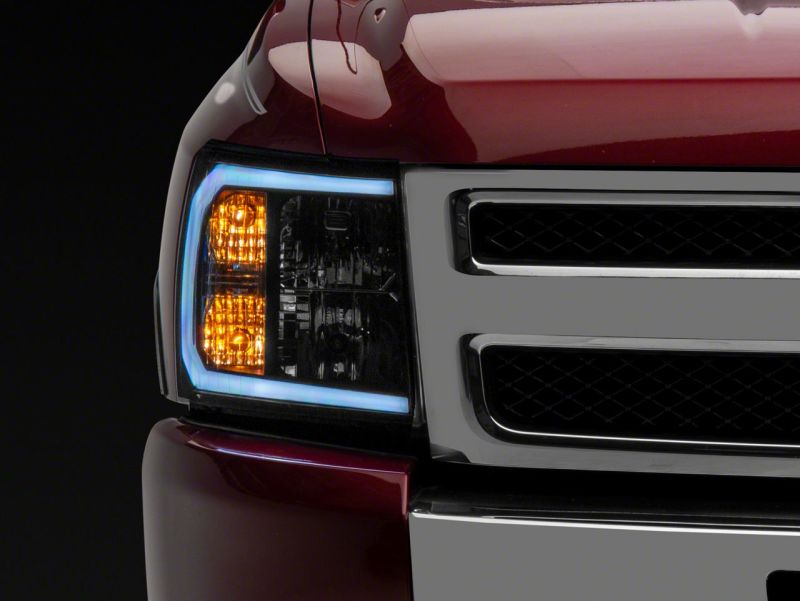 Raxiom 07-13 Chevrolet Silverado 1500 Axial Series Headlights w/ LED Bar- Black Housing (Clear Lens) Headlights Raxiom