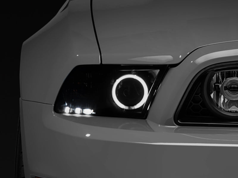 Raxiom 13-14 Ford Mustang w/ Factory HIDLED Halo Projector Headlights- Black Housing (Smoked Lens) Headlights Raxiom