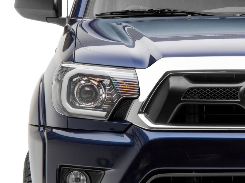 Raxiom 12-15 Toyota Tacoma Axial Series Projector Headlights w/ LED Bar- Black Housing (Clear Lens) Headlights Raxiom