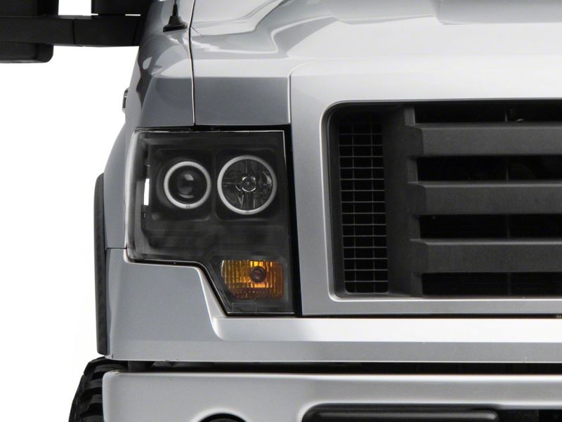 Raxiom 09-14 Ford F-150 Super White LED Halo Projector Headlights- Black Housing (Clear Lens) Headlights Raxiom