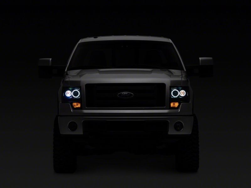 Raxiom 09-14 Ford F-150 Super White LED Halo Projector Headlights- Black Housing (Clear Lens) Headlights Raxiom