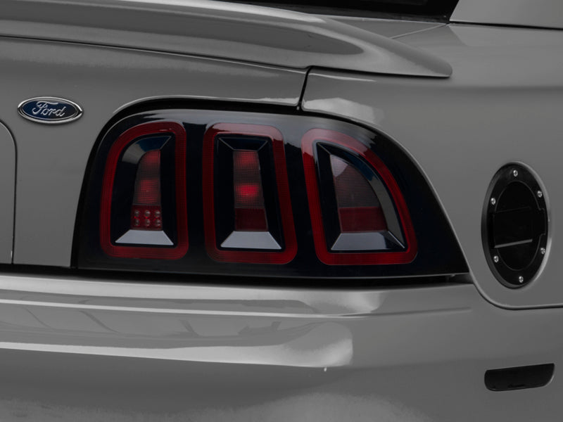 Raxiom 96-98 Ford Mustang Icon LED Tail Lights- Black Housing (Smoked Lens) Tail Lights Raxiom