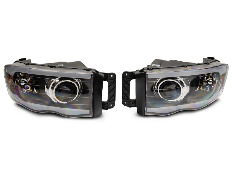 Raxiom 02-05 Dodge RAM 1500/2500/3500 Axial LED Projector Headlights- Blk Housing (Clear Lens) Headlights Raxiom