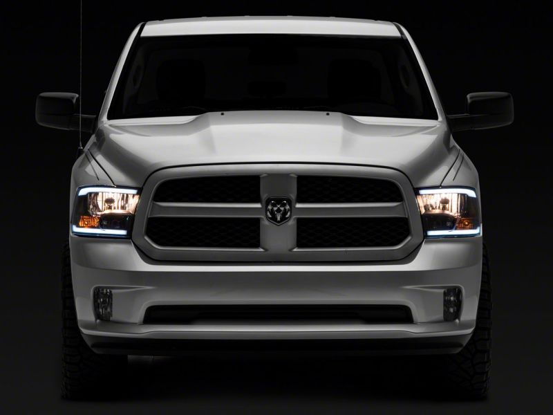 Raxiom 09-18 Dodge RAM 1500/2500/3500 Axial Series Headlights w/ LED Bar- Black Housing (Clear Lens) Headlights Raxiom