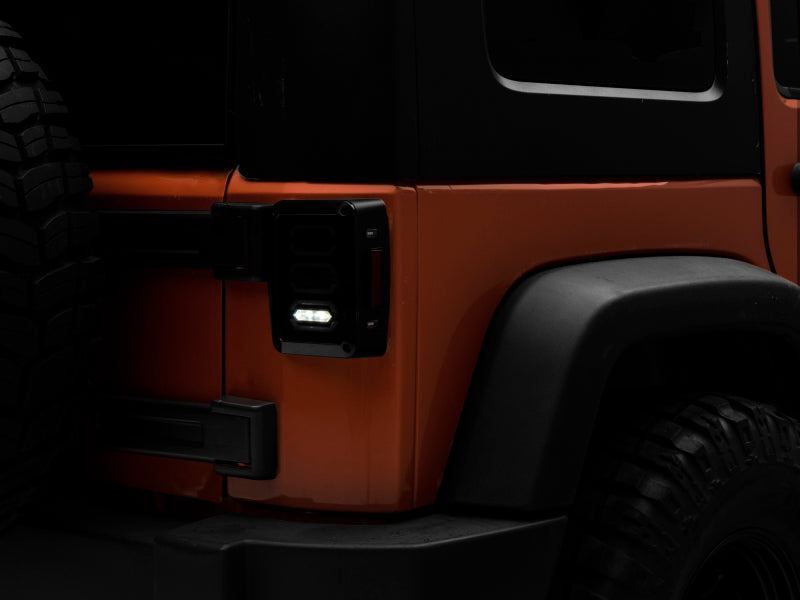 Raxiom 07-18 Jeep Wrangler JK LED Tail Lights- Black Housing (Smoked Lens) Tail Lights Raxiom