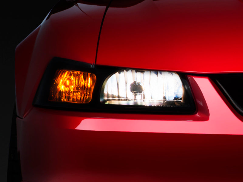 Raxiom 99-04 Ford Mustang Axial Series OE Style Headlights- Black Housing (Smoked Lens) Headlights Raxiom