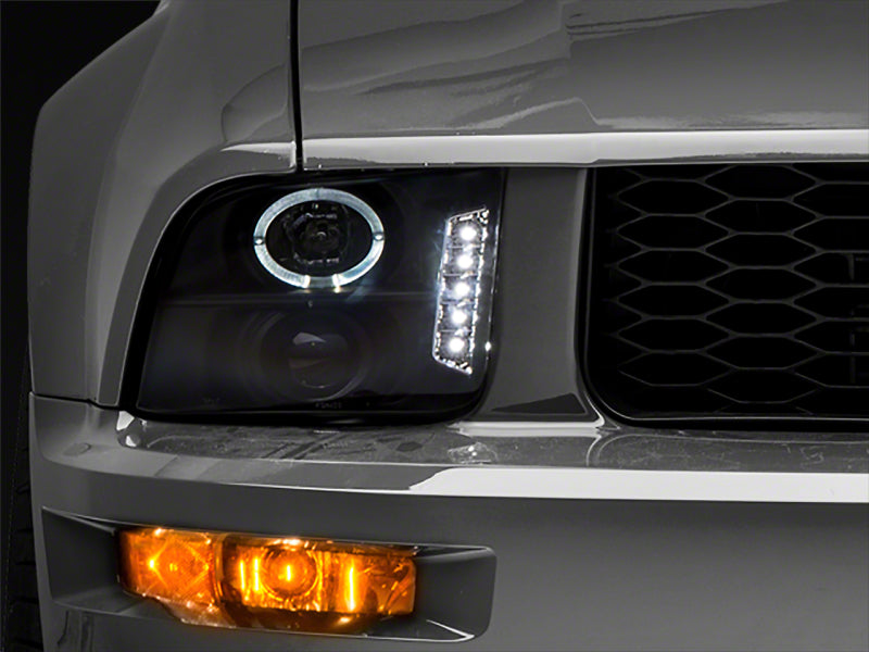 Raxiom 05-09 Ford Mustang Excluding GT500 LED Halo Projector Headlights- Blk Housing (Clear Lens) Headlights Raxiom