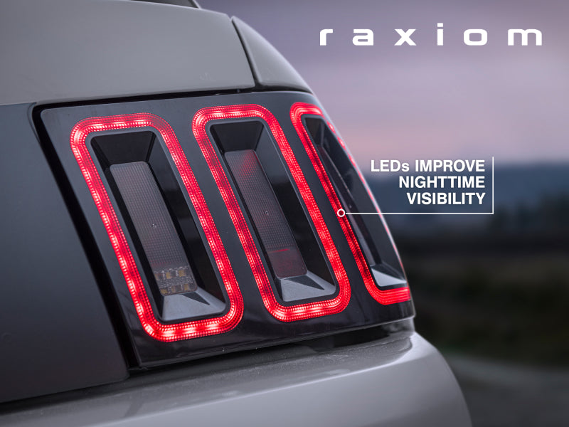 Raxiom 99-04 Ford Mustang Excluding 99-01 Cobra Icon LED Tail Lights- Black Housing (Smoked Lens) Tail Lights Raxiom