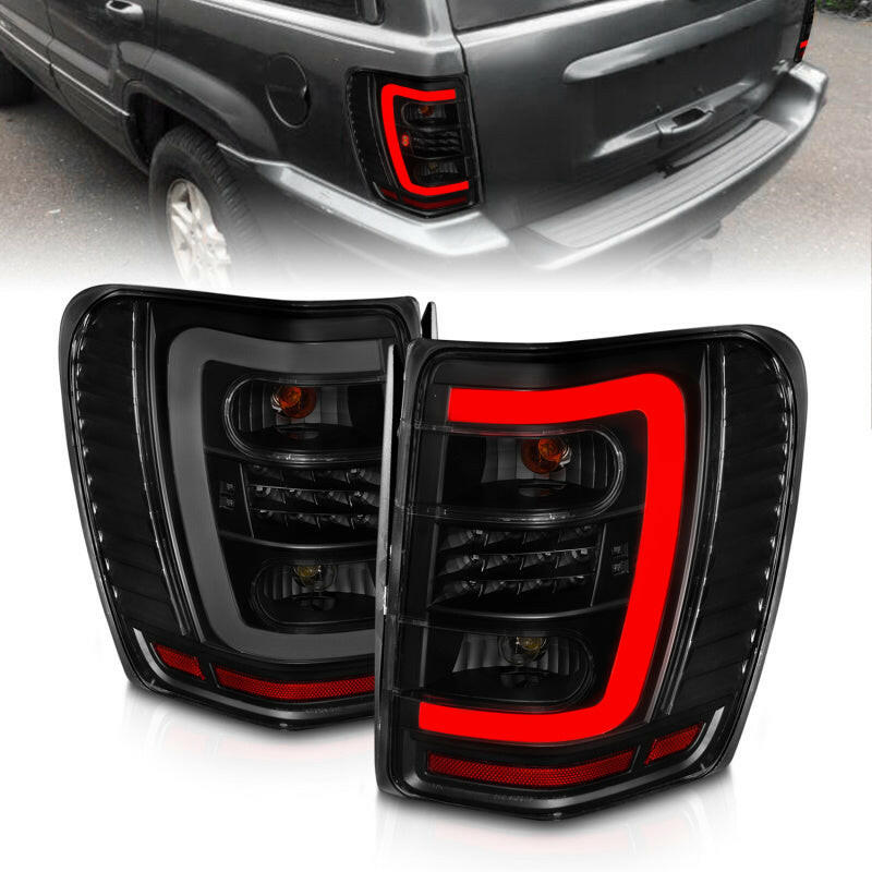ANZO 1999-2004 Jeep Grand Cherokee LED Tail Lights w/ Light Bar Black Housing Smoke Lens Tail Lights ANZO