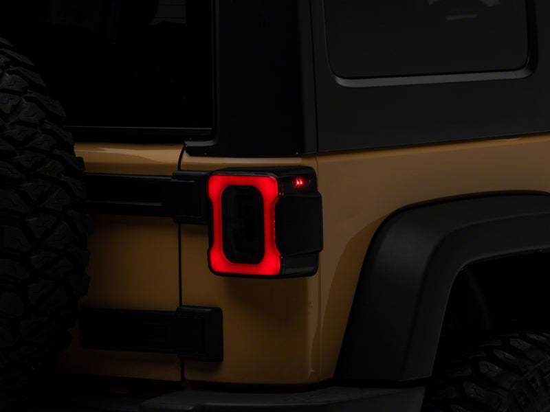 Raxiom 07-18 Jeep Wrangler JK Axial Series LED Tail Lights- Blk Housing (Smoked Lens) Tail Lights Raxiom