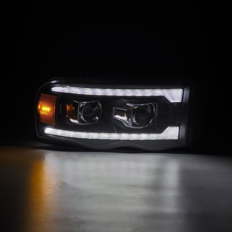 AlphaRex 02-05 Dodge Ram 1500 LUXX LED Proj Headlights Plank Style Black w/Activ Light/Seq Signal Headlights AlphaRex