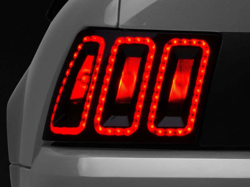 Raxiom 99-04 Ford Mustang Excluding 99-01 Cobra Icon LED Tail Lights- Black Housing (Smoked Lens) Tail Lights Raxiom