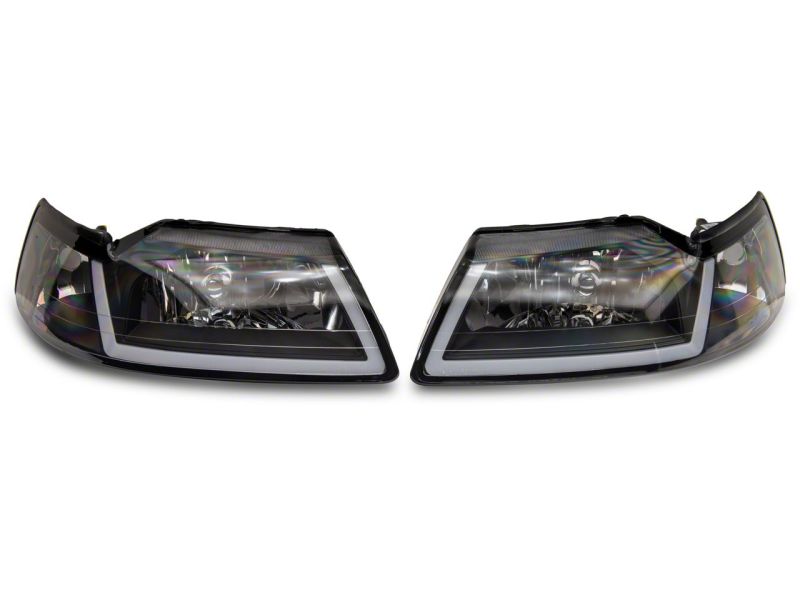 Raxiom 99-04 Ford Mustang Axial Series Headlights w/ Sequential LED Bar- Blk Housing (Clear Lens) Headlights Raxiom