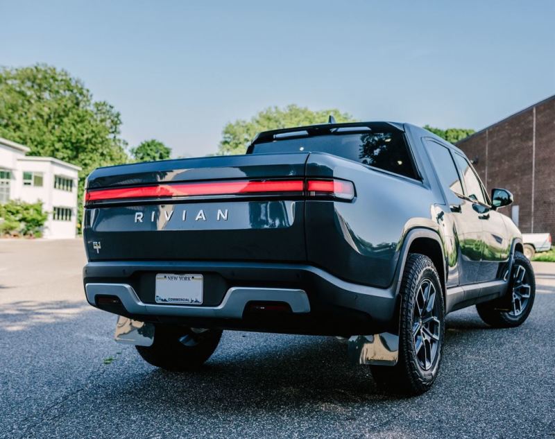 Rally Armor 22-25 Rivian R1T Black UR Mud Flap w/Tangerine Scream Logo Mud Flaps Rally Armor