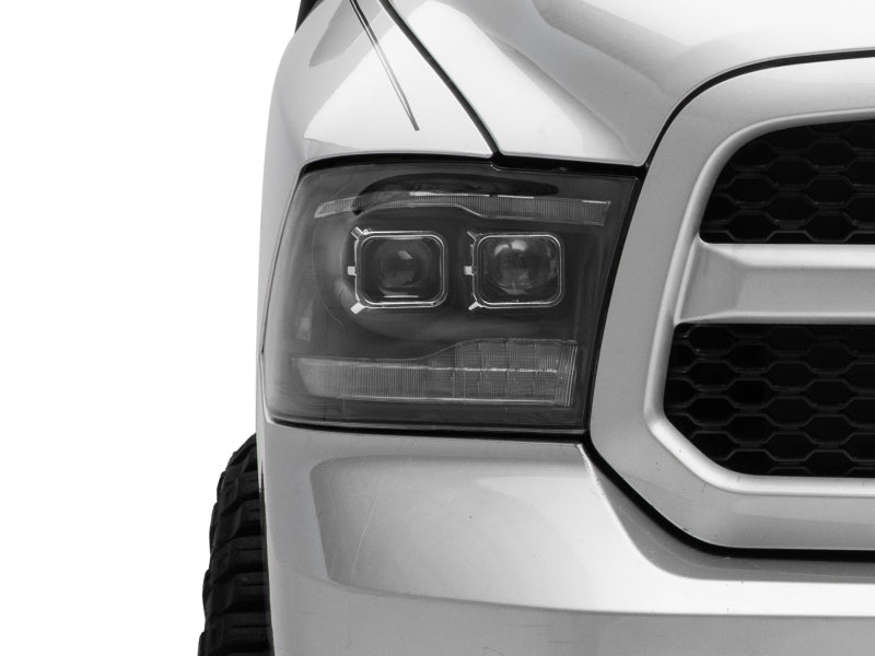 Raxiom 09-18 RAM 1500 LED Projector Headlights w/ Switchback Turn Signals- Blk Housing (Clear Lens) Headlights Raxiom