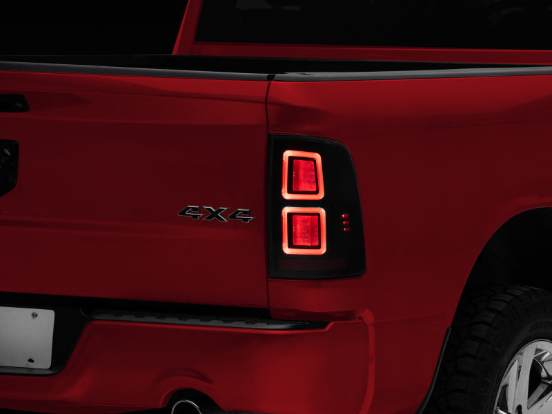 Raxiom 09-18 Dodge RAM 1500 LED Tail Lights- Black Housing (Smoked Lens) Tail Lights Raxiom