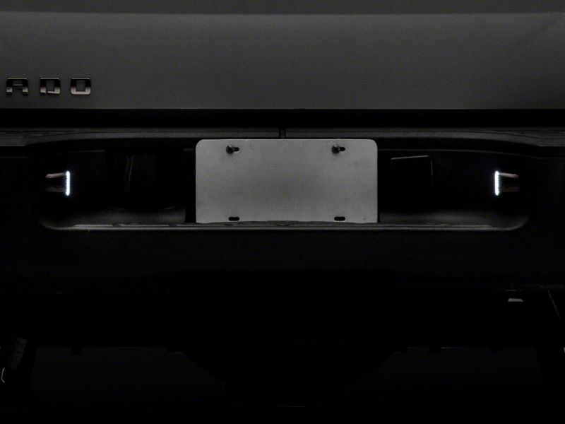 Raxiom 01-13 Chevrolet Silverado/GMC Sierra 1500 Axial Series LED License Plate Lamps- Smoked Bulbs Raxiom