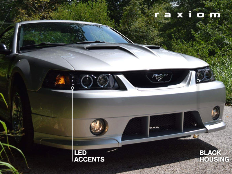 Raxiom 99-04 Ford Mustang Dual LED Halo Projector Headlights- Black Housing (Clear Lens) Headlights Raxiom