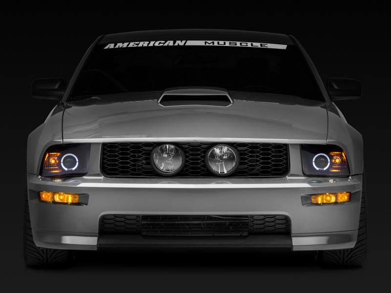 Raxiom 05-09 Ford Mustang Halogen 2010 Style LED Halo Headlights-Blk Hsng(Clear Lens/Excludes GT500) Headlights Raxiom
