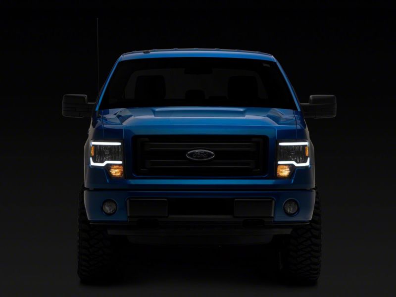 Raxiom 09-14 Ford F-150 Axial Series Headlights w/ LED Bar- Blk Housing (Clear Lens) Headlights Raxiom