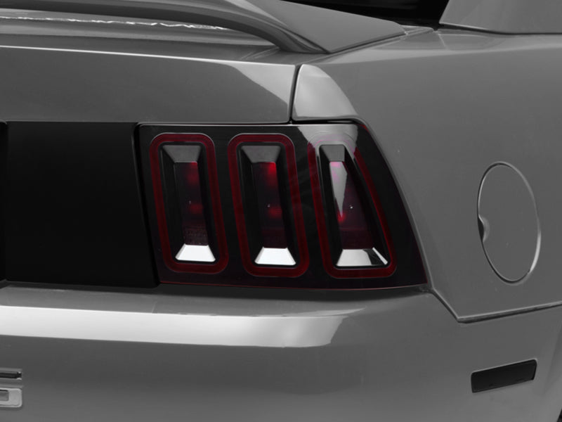 Raxiom 99-04 Ford Mustang Excluding 99-01 Cobra Icon LED Tail Lights- Black Housing (Smoked Lens) Tail Lights Raxiom