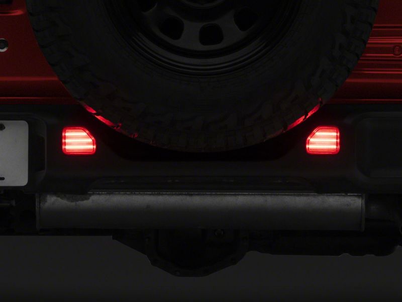 Raxiom 18-23 Jeep Wrangler JL Moab Rubicon Sahara Axial LED Rear Bumper Reflector Lights- Clear Light Bars & Cubes Raxiom