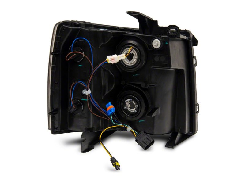 Raxiom 07-13 Chevrolet Silverado 1500 Axial Headlights w/ SEQL LED Bar- Black Housing (Clear Lens) Headlights Raxiom