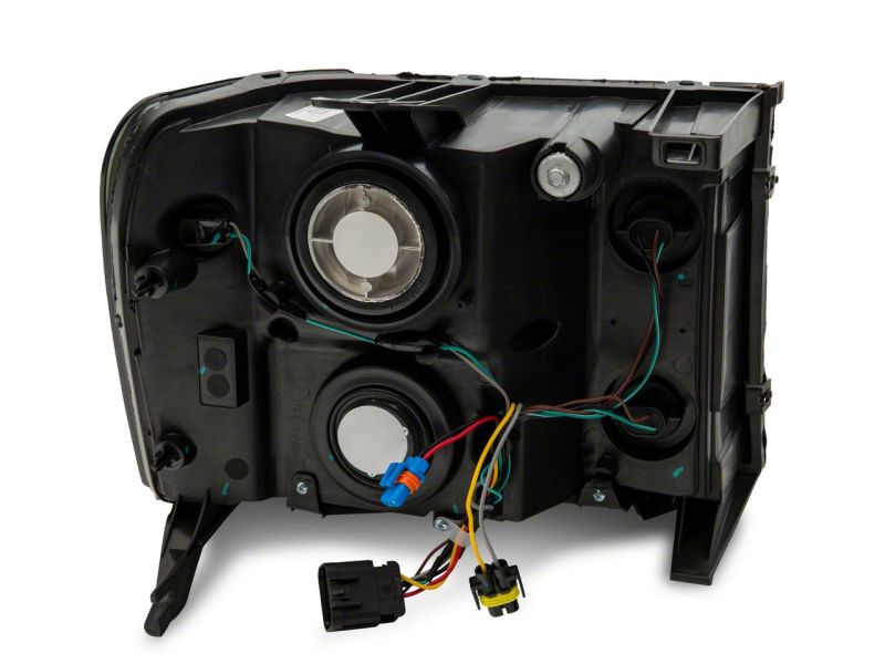 Raxiom 07-14 GMC Sierra 1500/2500 HD/3500 HD Axial OEM Rep Headlights- Chrome Housing- Smoked Lens Headlights Raxiom