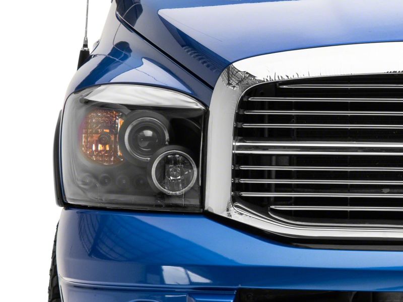 Raxiom 06-08 Dodge RAM 1500 LED Halo Projector Headlights- Blk Housing (Clear Lens) Headlights Raxiom
