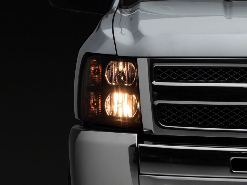 Raxiom 07-13 Chevrolet Silverado 1500 Euro Headlights- Black Housing (Clear Lens) Headlights Raxiom