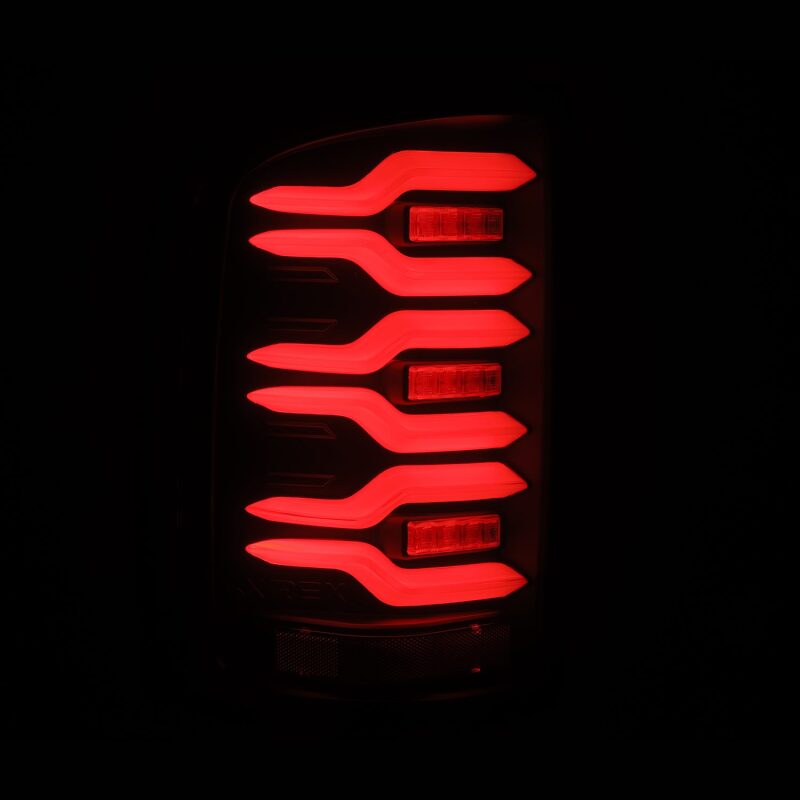 AlphaRex 14-18 GMC Sierra 1500/2500HD/3500HD LUXX-Series LED Tail Lights Blk w/Actv Light & Seq. Sig Tail Lights AlphaRex