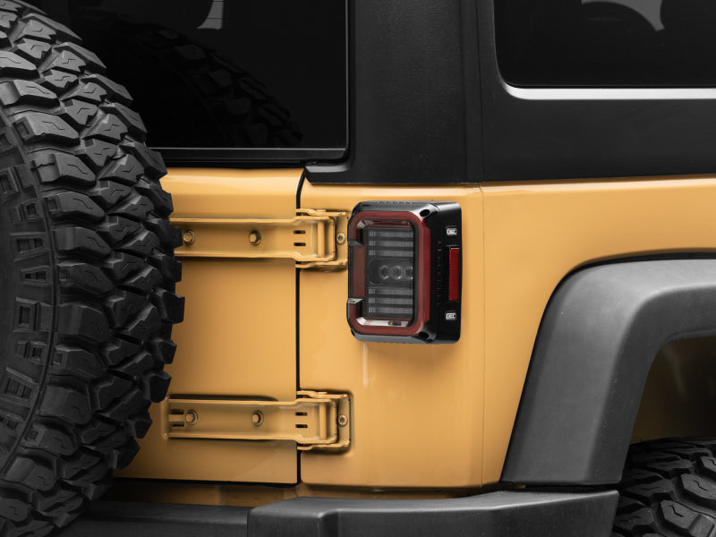 Raxiom 07-18 Jeep Wrangler JK Axial Series LED Halo Tail Lights- Black Housing (Dark Smoked Lens) Tail Lights Raxiom