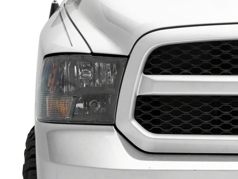 Raxiom 09-18 Dodge RAM 1500 Axial Series Euro Style Headlights w/ Dual Bulb Blk Housing (Clear Lens) Headlights Raxiom