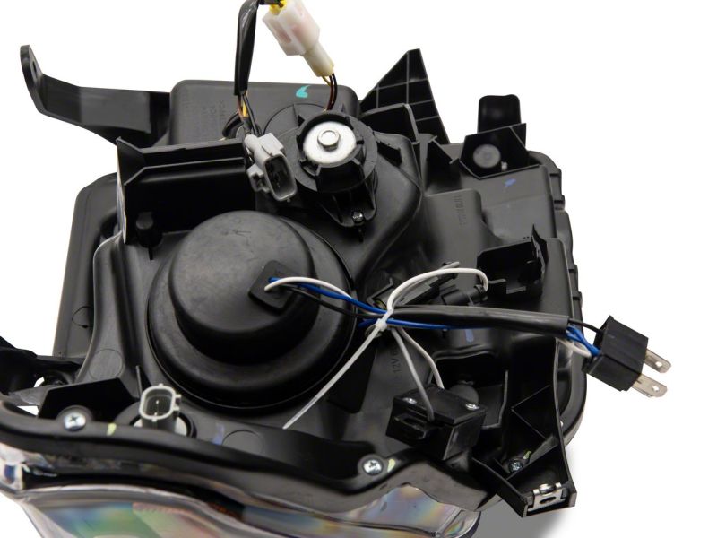 Raxiom 14-21 Toyota Tundra Axial Projector Headlights w/ SEQL LED Bar- Black Housing (Clear Lens) Headlights Raxiom
