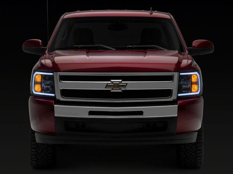 Raxiom 07-13 Chevrolet Silverado 1500 Axial Headlights w/ SEQL LED Bar- Black Housing (Clear Lens) Headlights Raxiom