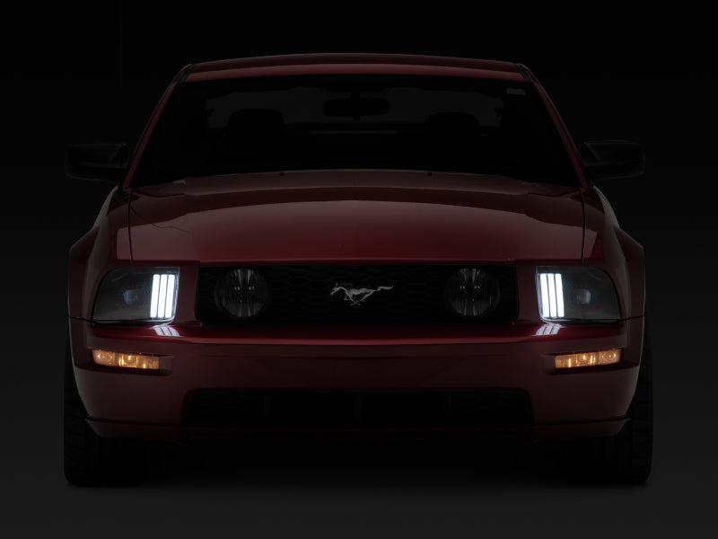 Raxiom 05-09 Ford Mustang w/ Halogen Prjctor Headlights- Black Housing (Clear Lens) (No GT500 ) Headlights Raxiom