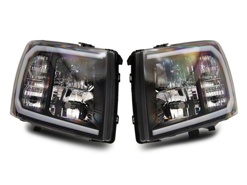 Raxiom 07-13 Chevrolet Silverado 1500 Axial Series Headlights w/ LED Bar- Black Housing (Clear Lens) Headlights Raxiom