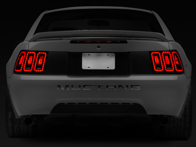 Raxiom 99-04 Ford Mustang Excluding 99-01 Cobra Icon LED Tail Lights- Black Housing (Smoked Lens) Tail Lights Raxiom