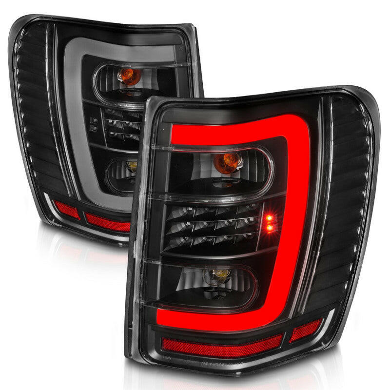 ANZO 1999-2004 Jeep Grand Cherokee LED Tail Lights w/ Light Bar Black Housing Clear Lens Tail Lights ANZO