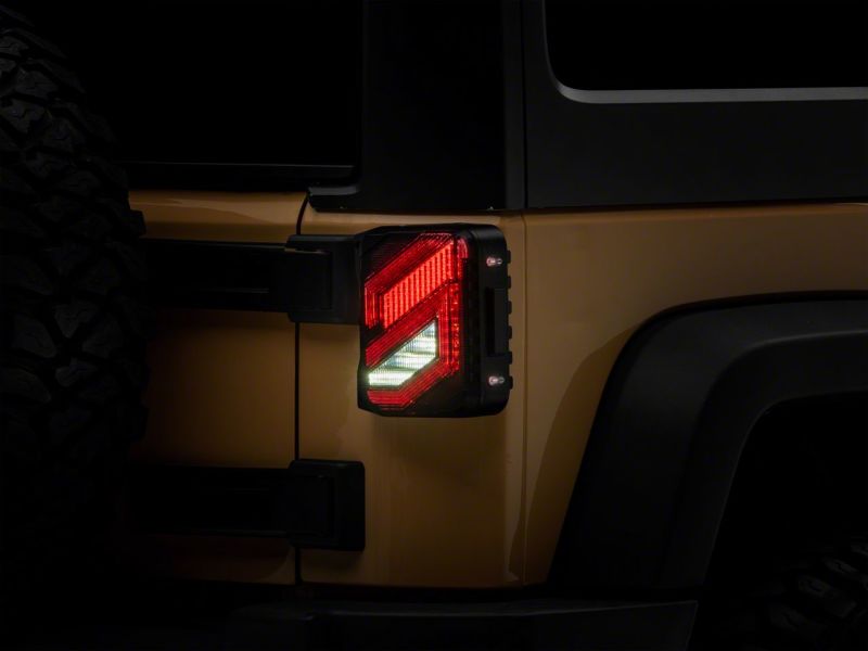 Raxiom 07-18 Jeep Wrangler JK Axial Series Trident LED Tail Lights- Blk Housing (Smoked Lens) Tail Lights Raxiom