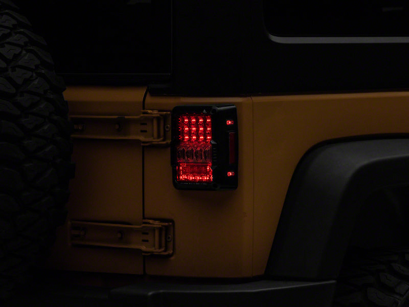 Raxiom 07-18 Jeep Wrangler JK Axial Series Lux LED Tail Lights- Blk Housing (Clear Lens) Tail Lights Raxiom