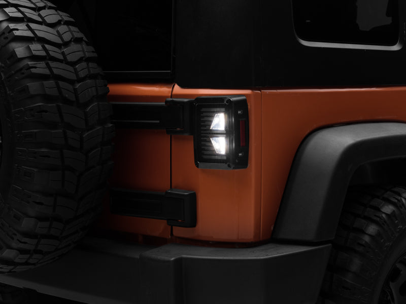 Raxiom 07-18 Jeep Wrangler JK Axial Series Vision LED Tail Lights- Black Housing (Smoked Lens) Tail Lights Raxiom