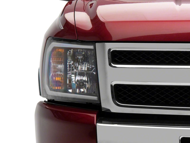 Raxiom 07-13 Chevrolet Silverado 1500 Axial Headlights w/ SEQL LED Bar- Black Housing (Clear Lens) Headlights Raxiom