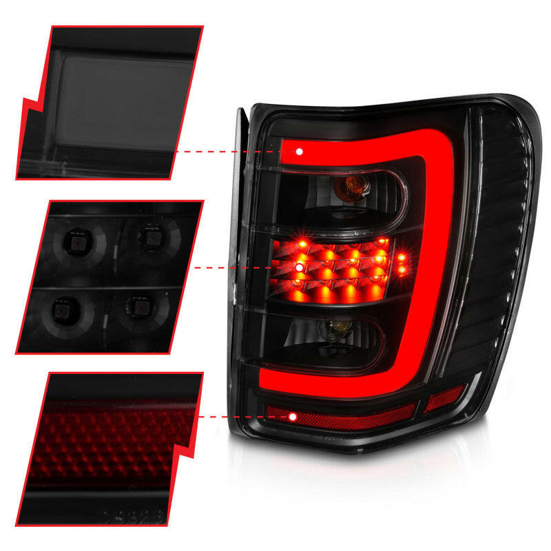 ANZO 1999-2004 Jeep Grand Cherokee LED Tail Lights w/ Light Bar Black Housing Smoke Lens Tail Lights ANZO