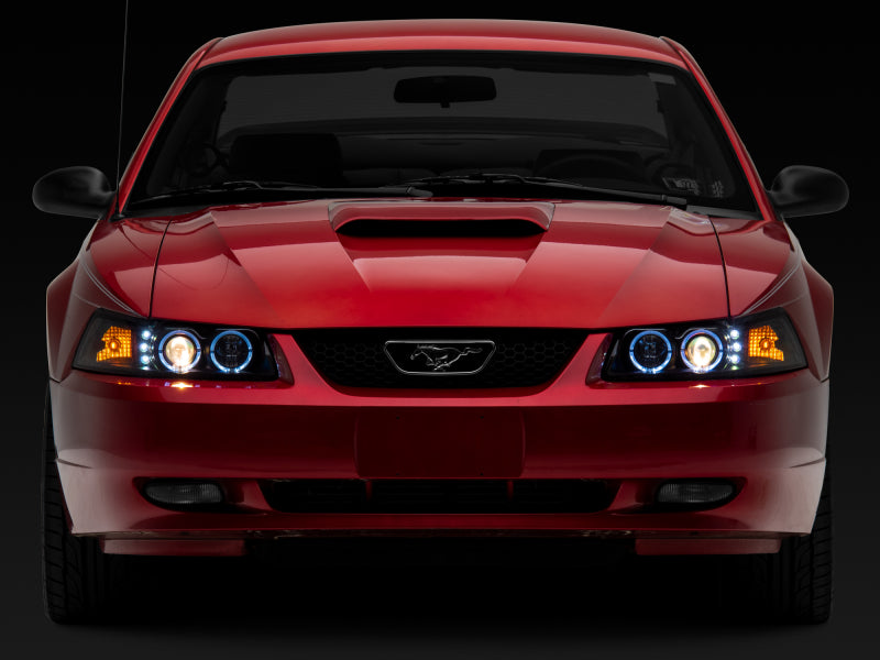 Raxiom 99-04 Ford Mustang Dual LED Halo Projector Headlights- Black Housing (Clear Lens) Headlights Raxiom